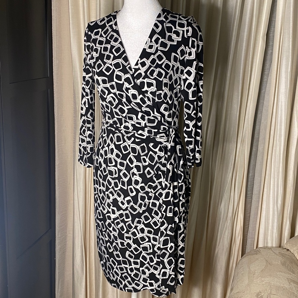 Ivy & Blu Maggy Boutique | faux wrap Black Dress with White Geometric Patterns